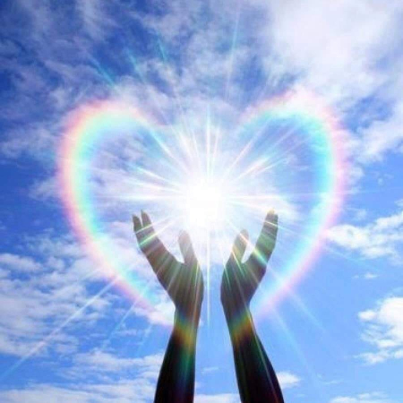 Hands and love heart rainbow